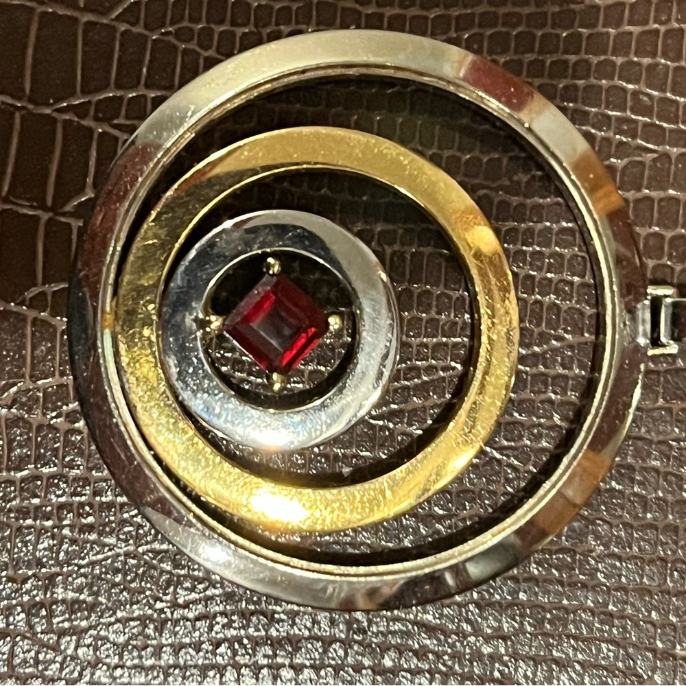 Elegant Gold and Silver Pendant with Red Accent